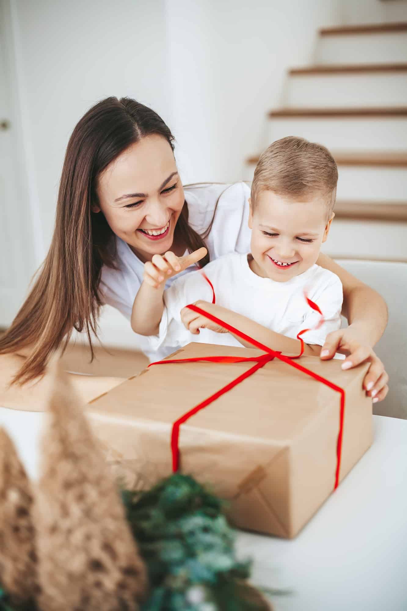 Happy family packing a Christmas gift